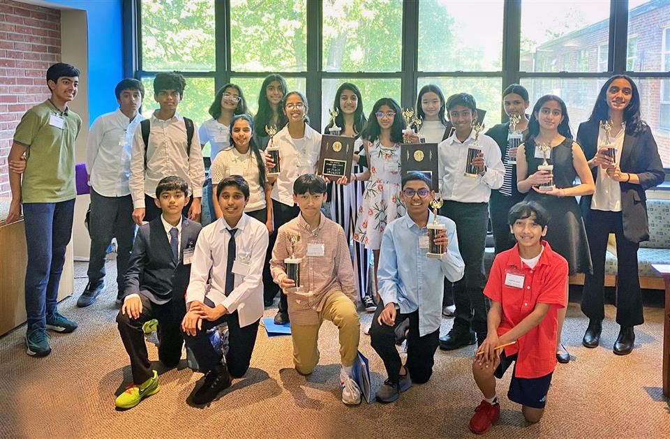 middle school debate team members with awards